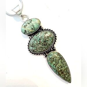 2 1/2 inch, 3 stone, African Turquoise  pendant on a silver chain.
